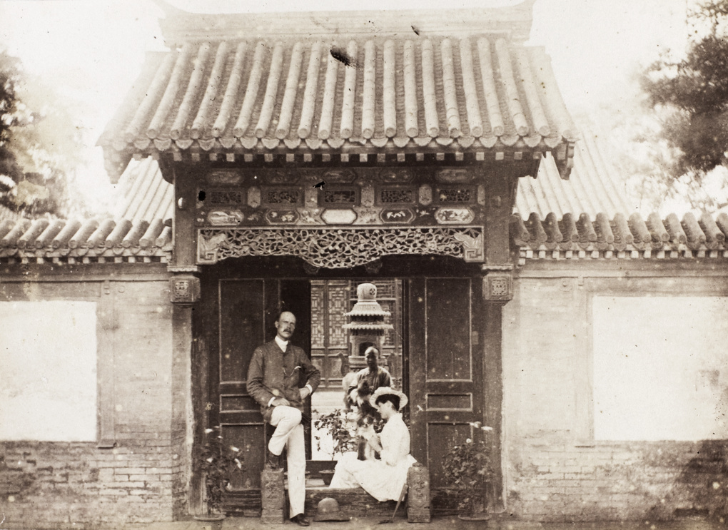 A European couple beside the entrance to a house, Beijing (北京)