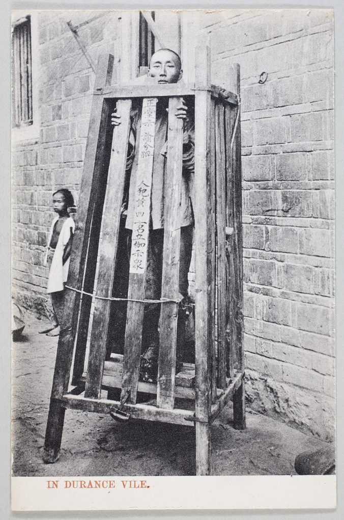 A man in a wooden cage, used for slow execution