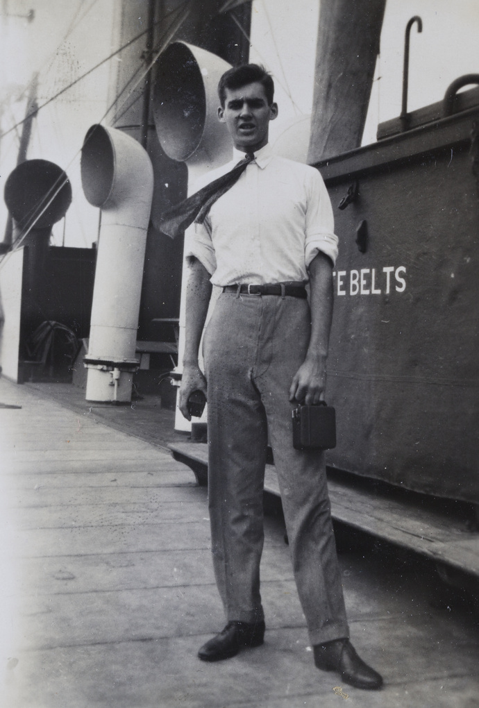 Jack Ephgrave with a camera, on board SS Whangpu