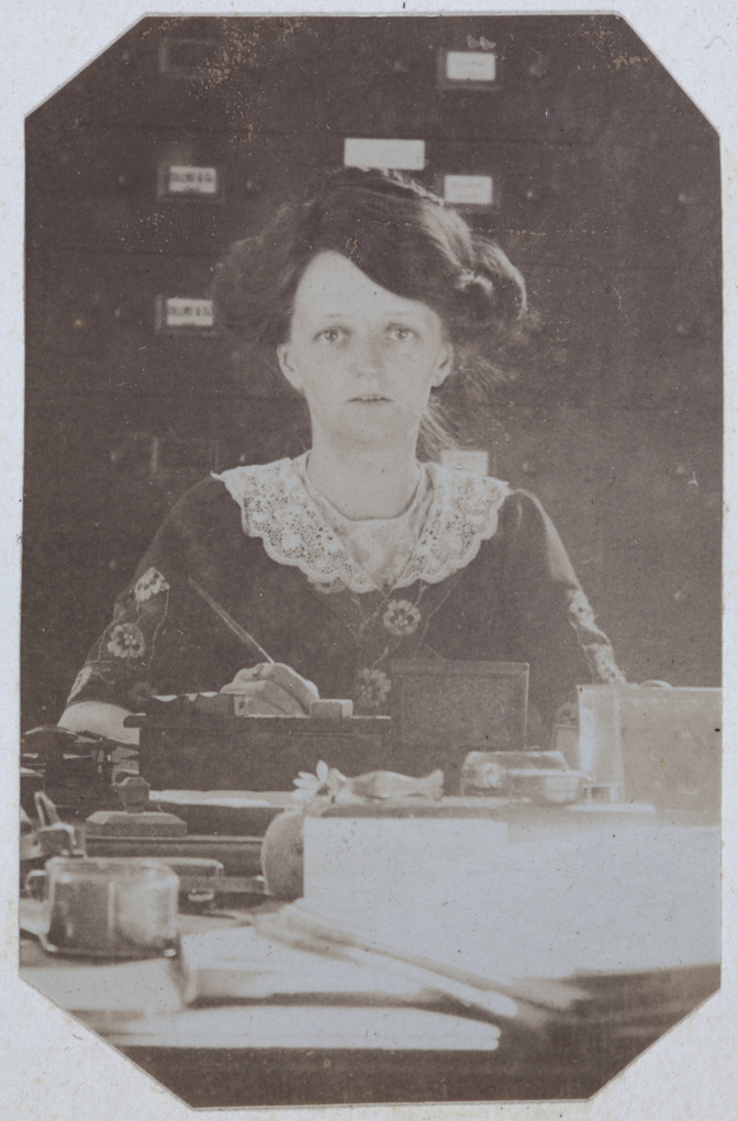 Edith Chappel writing at a desk, Tianjin