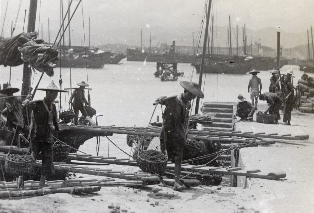 Stevedores unloading cargo from a boat
