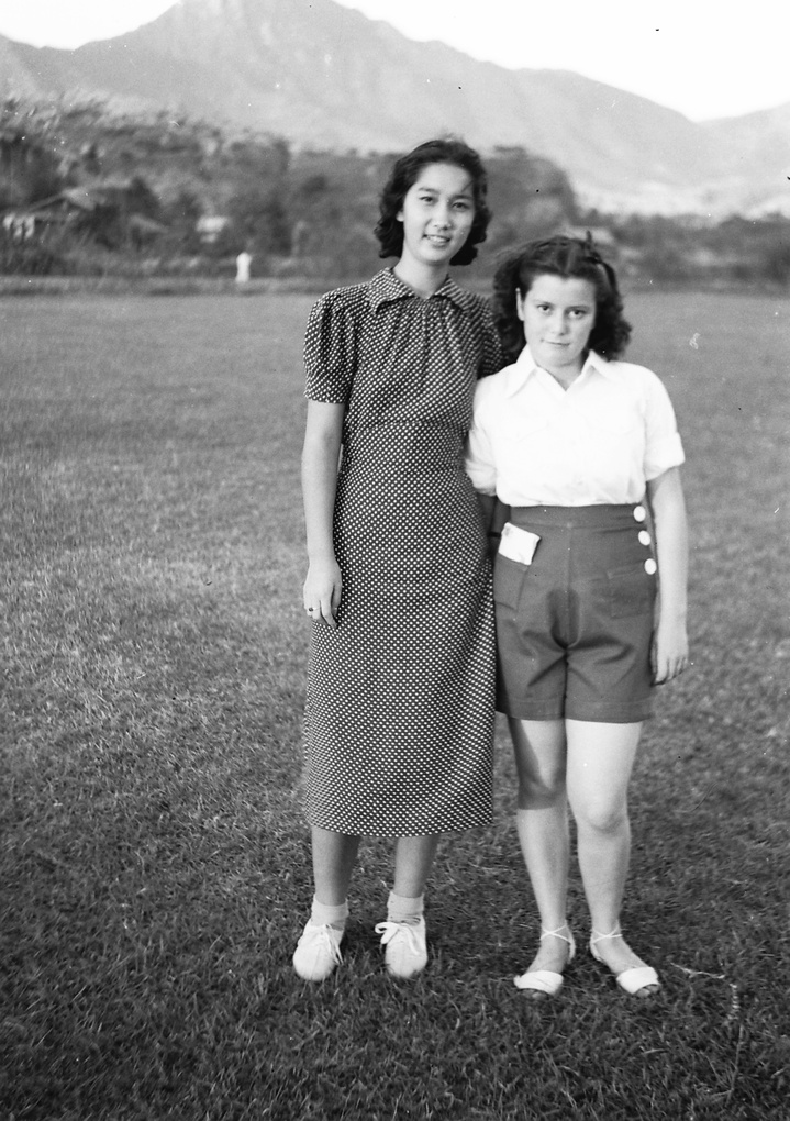 Bea Hutchinson with an unidentified girl, near the Army Sports Ground, Mongkok, Hong Kong