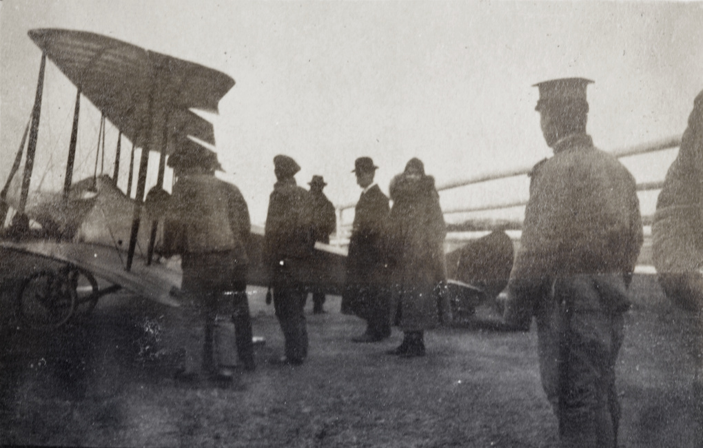 Katherine Stinson with crew and soldiers around her airplane, Jiangwan airfield, Shanghai