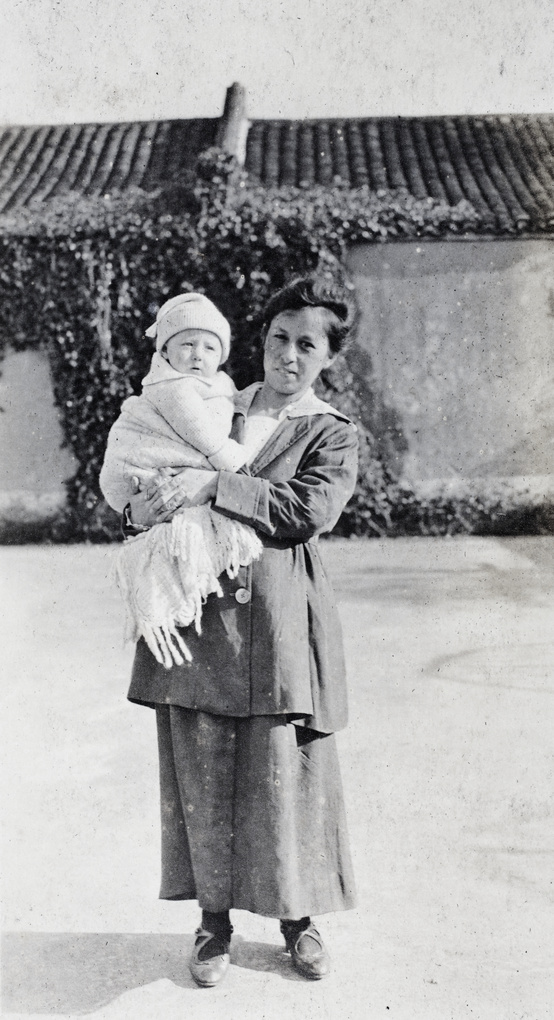 Woman holding a baby, Shanghai