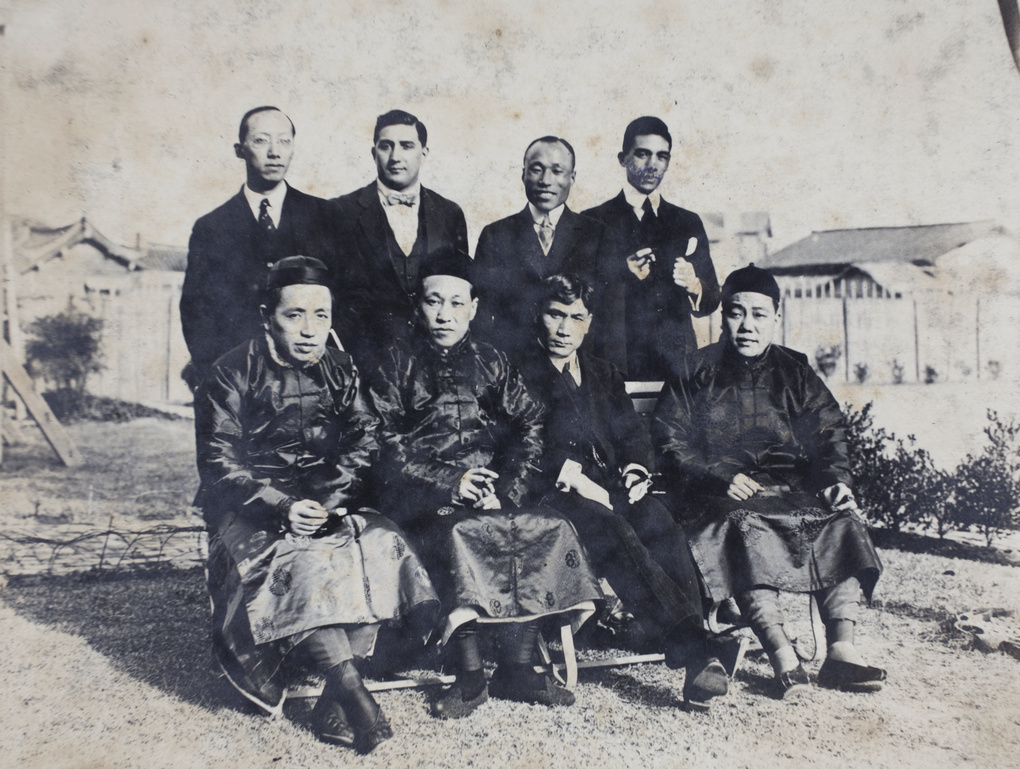 Charles, William, and Bill Hutchinson with five unidentified men in the garden, 35 Tongshan Road, Hongkou, Shanghai