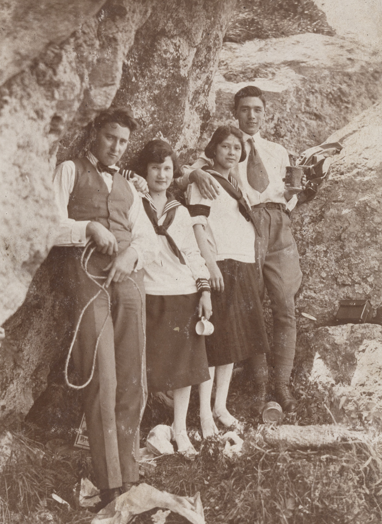 Mabel Parker and Bill Hutchinson standing on a rocky outcrop with other friends, Kunshan