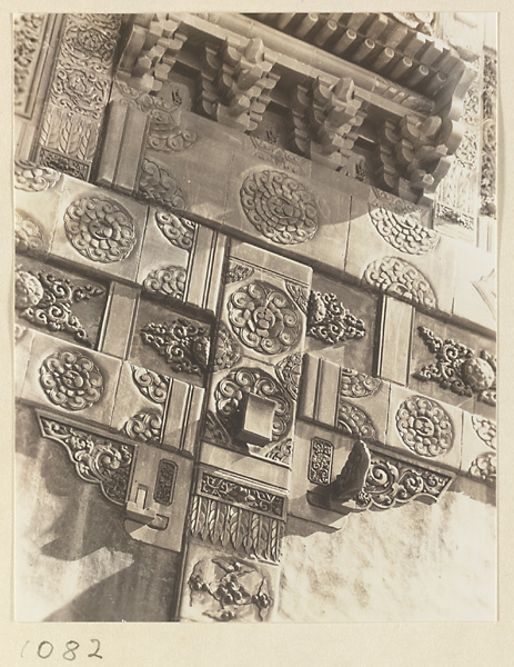 Detail of of Liu li pai fang showing glazed-tile relief work with vegetal motifs at Xu mi fu shou miao