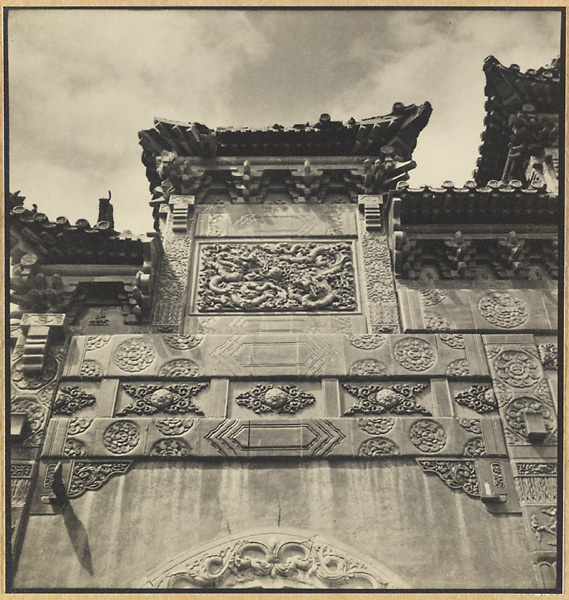 Detail of Liu li pai fang at Pu tuo zong cheng miao showing glazed-tile relief work and dragon panel