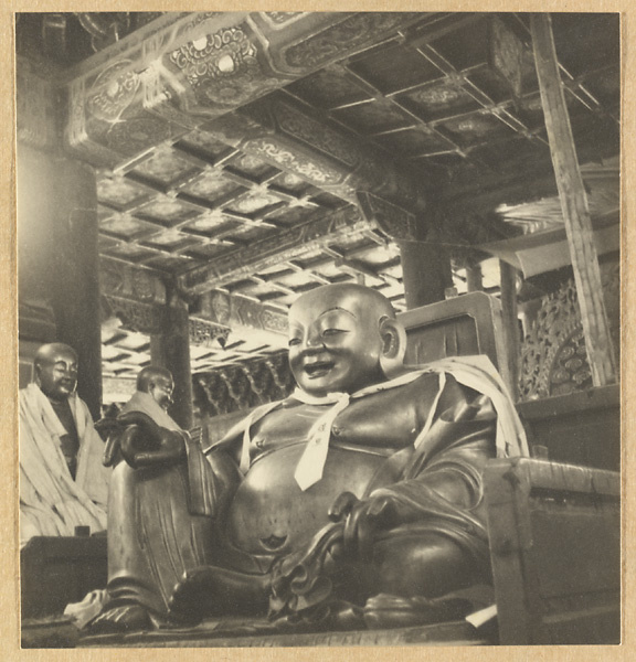 Interior view of the main hall at Luohan tang showing a statue of Buddha draped with a cloak