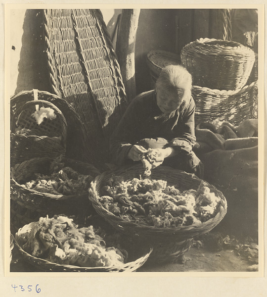 Woman with baskets of wool in Baoding