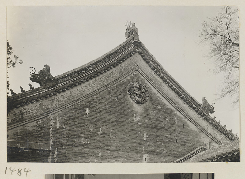 Detail of a roof showing a gable with roof ornaments at Qian men temple or Guan di miao