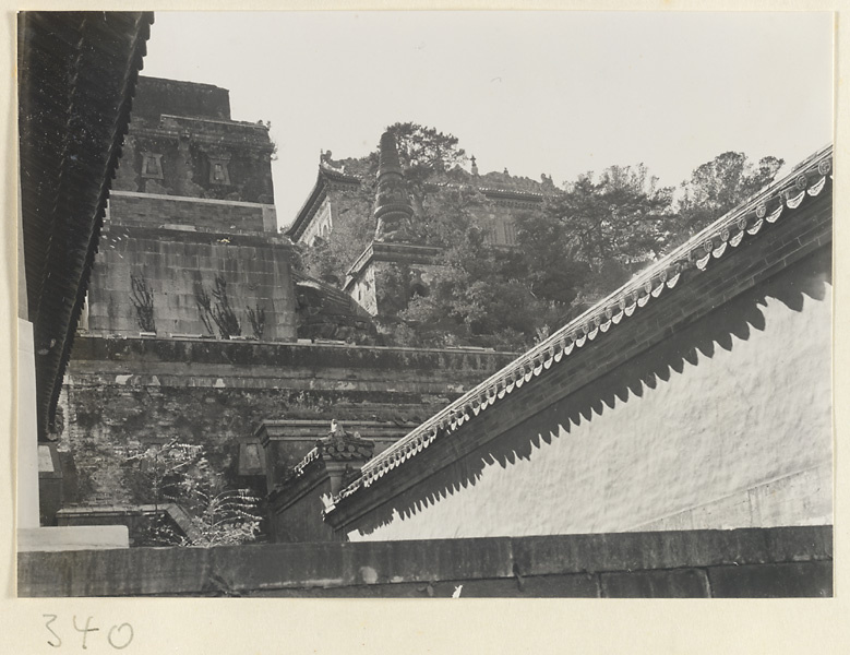 Buildings and stupa-style pagoda with Zhi hui hai in background on Back Hill at Yihe Yuan