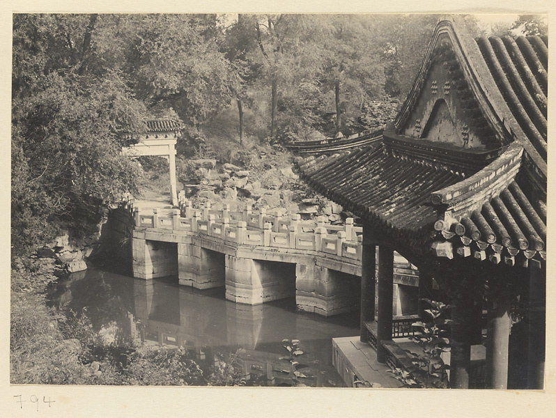 Stone bridge over Haopu Creek with pai lou and pavilion