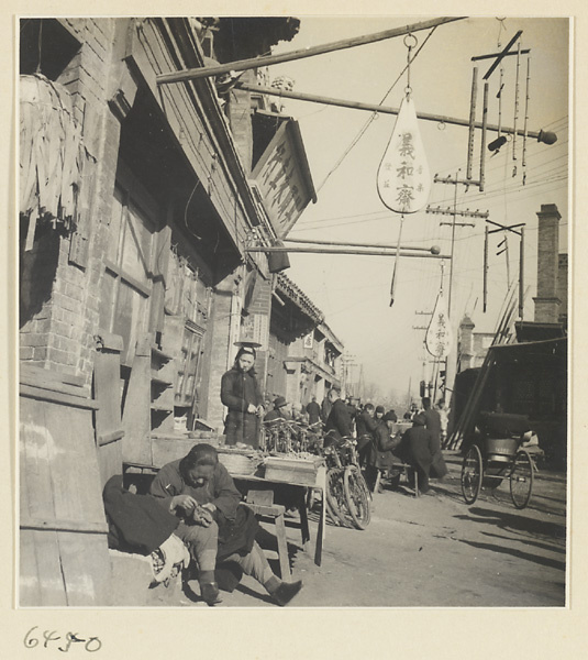 Street scene with shop signs for a musical instrument shop