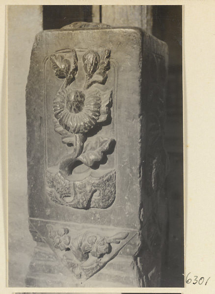 Carved door stone with floral motif