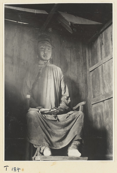 Temple interior showing seated, clothed statue on Tai Mountain