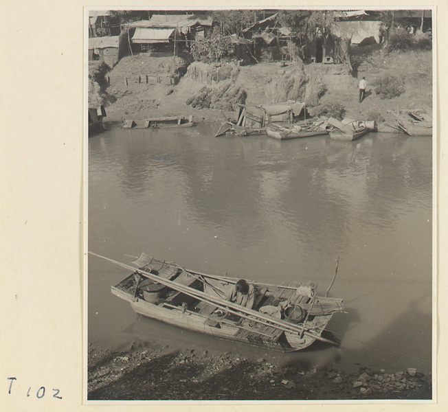 Boats on the river at Tai'an with houses in the background