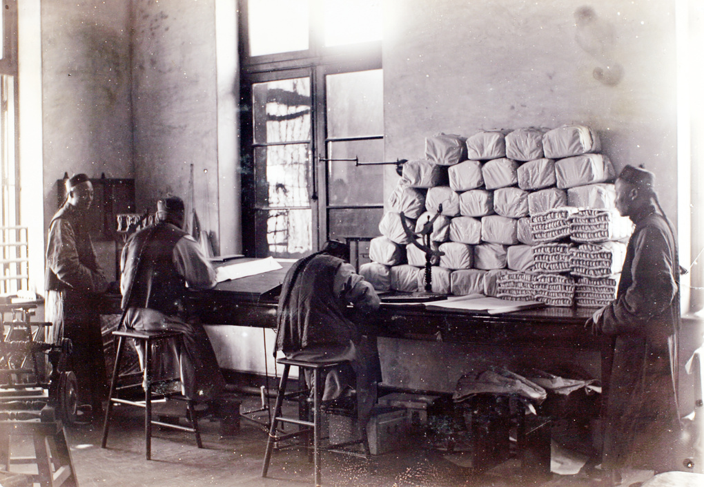 A silk inspection room and factory office, likely to be Arnhold, Karberg & Co., Shanghai