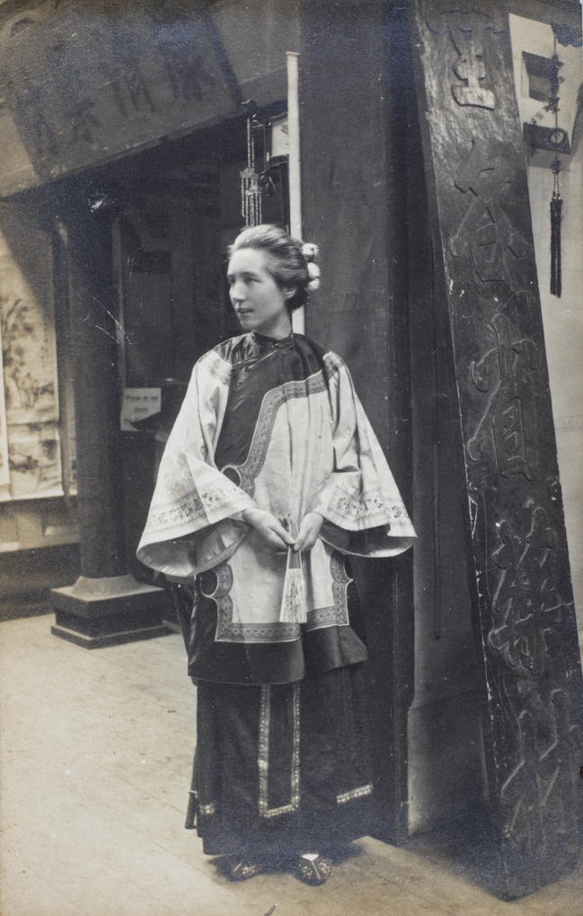 A woman (thought to be at a missionary-related event) wearing Chinese (Manchu) clothes, Luton, England