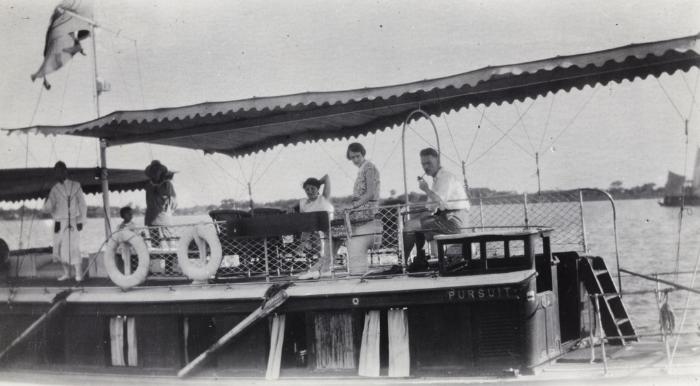 Crew and passengers aboard the houseboat 'Pursuit'