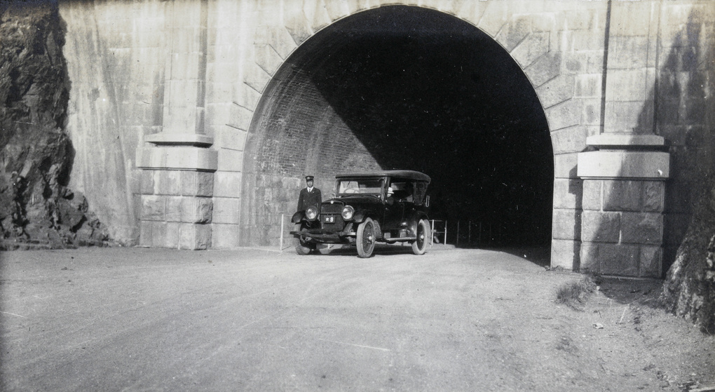 Automobile under the entrance to a tunnel