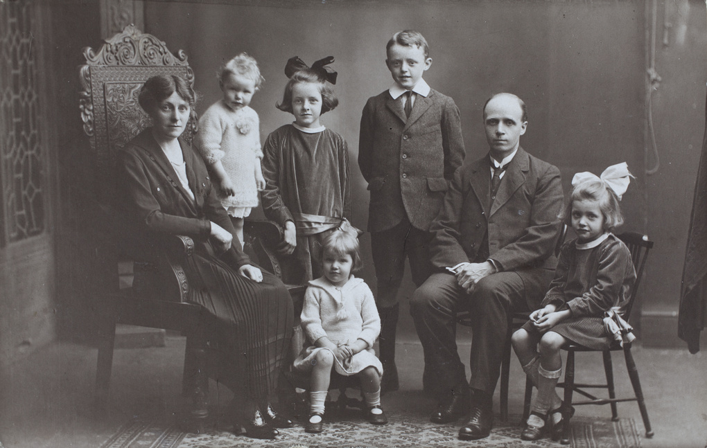 A studio portrait of the Mitchell family