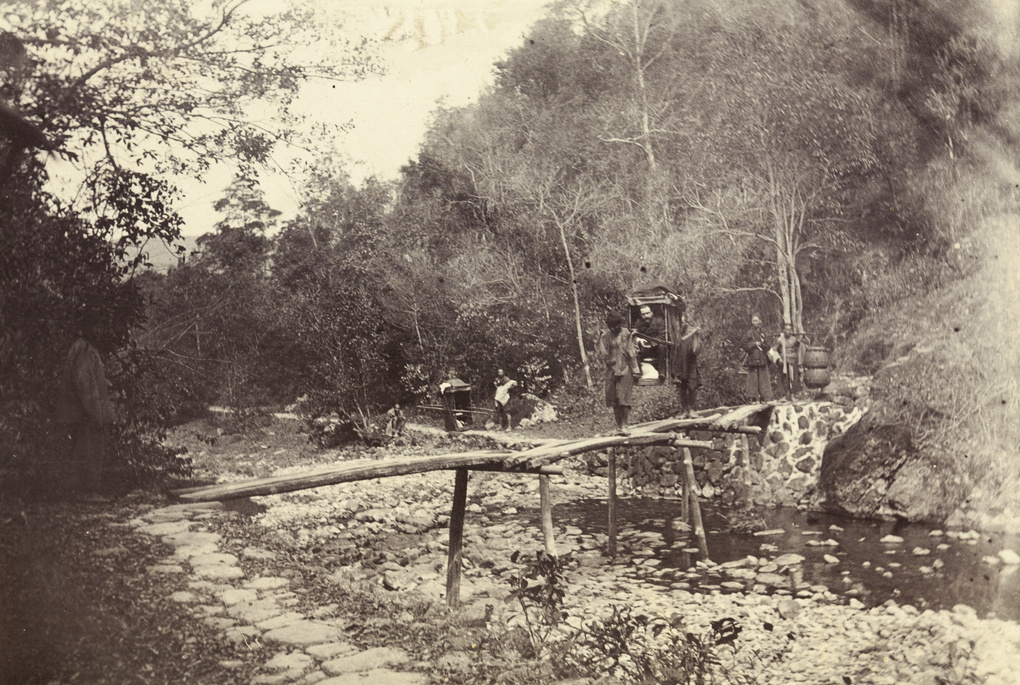 Sedan chair bearers crossing a wooden footbridge