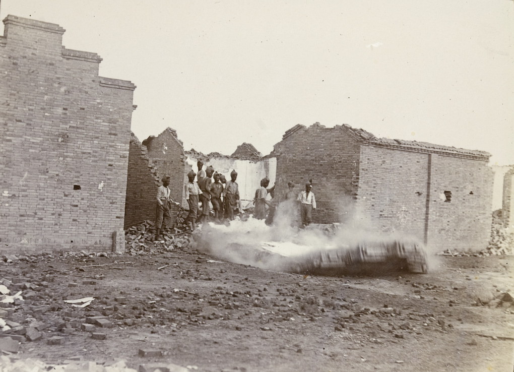 Madras Pioneers (British Indian troops) demolishing cover for snipers, Tianjin, 1900