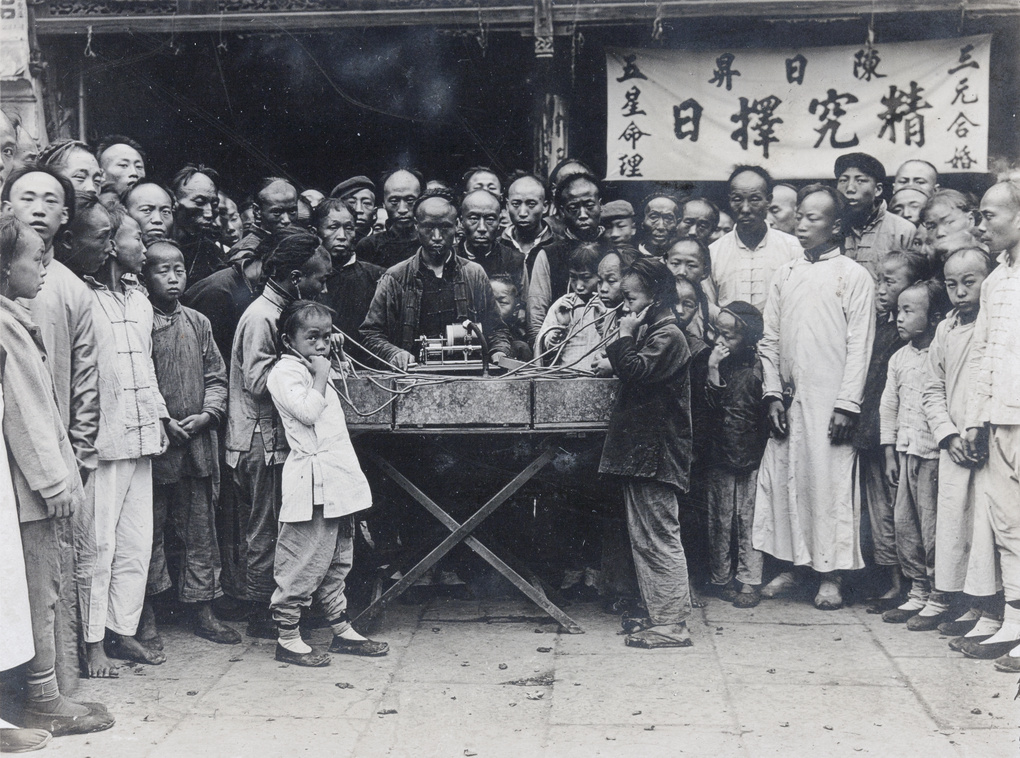 A street show demonstration of a phonograph, City God Temple (上海城隍庙), Shanghai