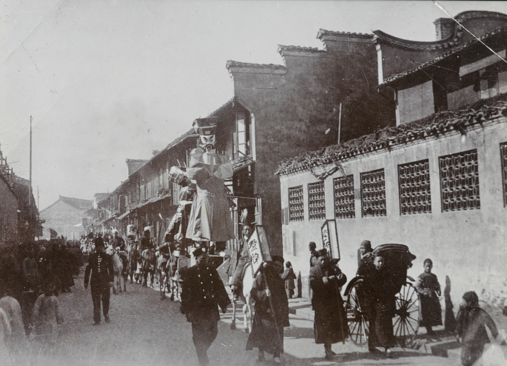 Procession on horseback, with paper giant
