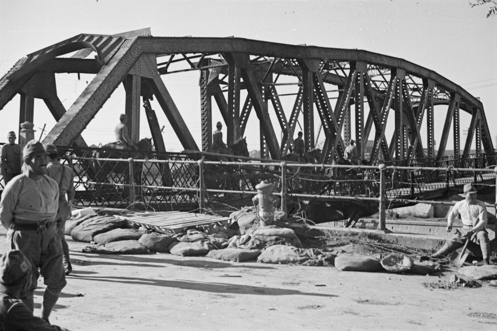 Mounted Japanese soldiers crossing Jessfield Railway Bridge, Shanghai
