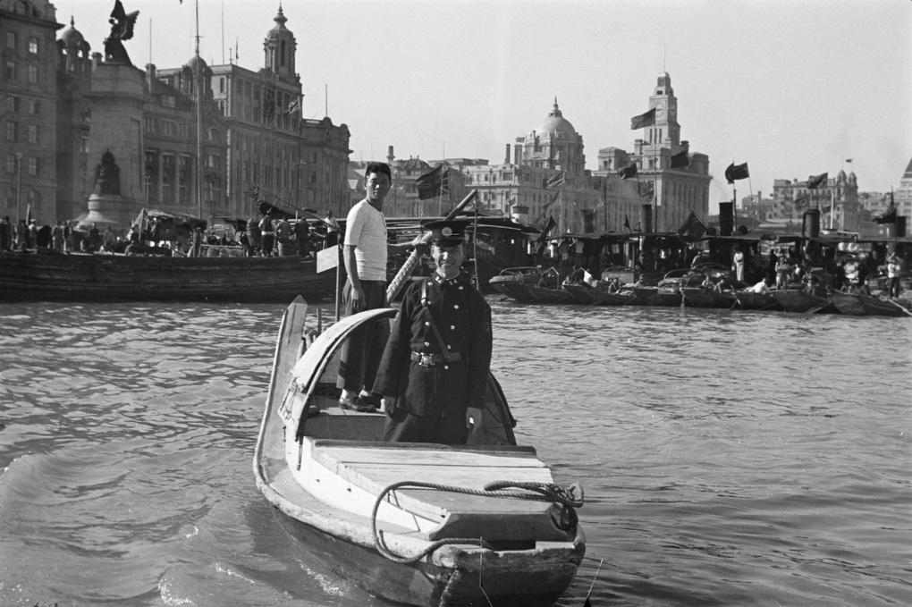 Shanghai Municipal Policeman in a water taxi, Shanghai
