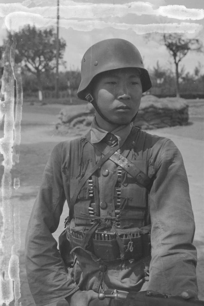 Nationalist soldier at barricade by Shell petrol station, Shanghai