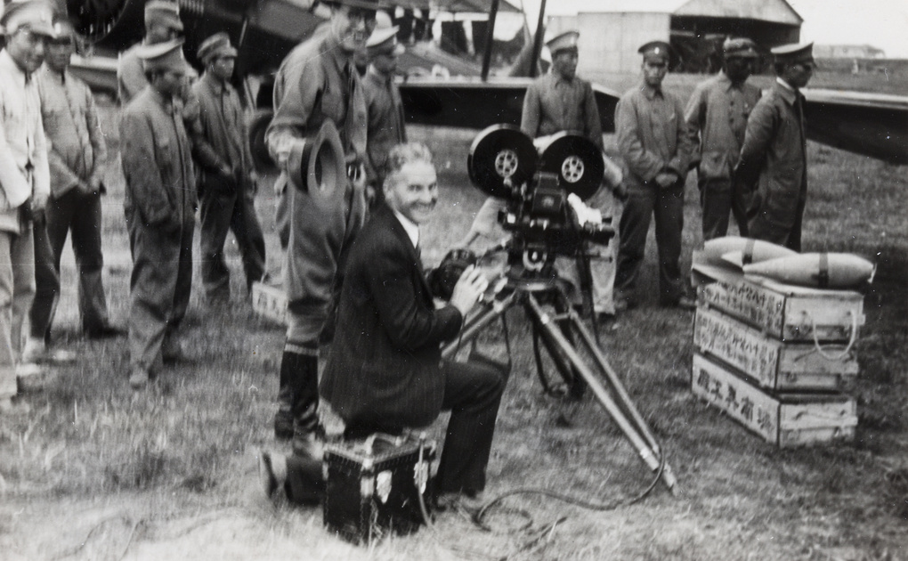 A. M. Alexander filming at an airfield