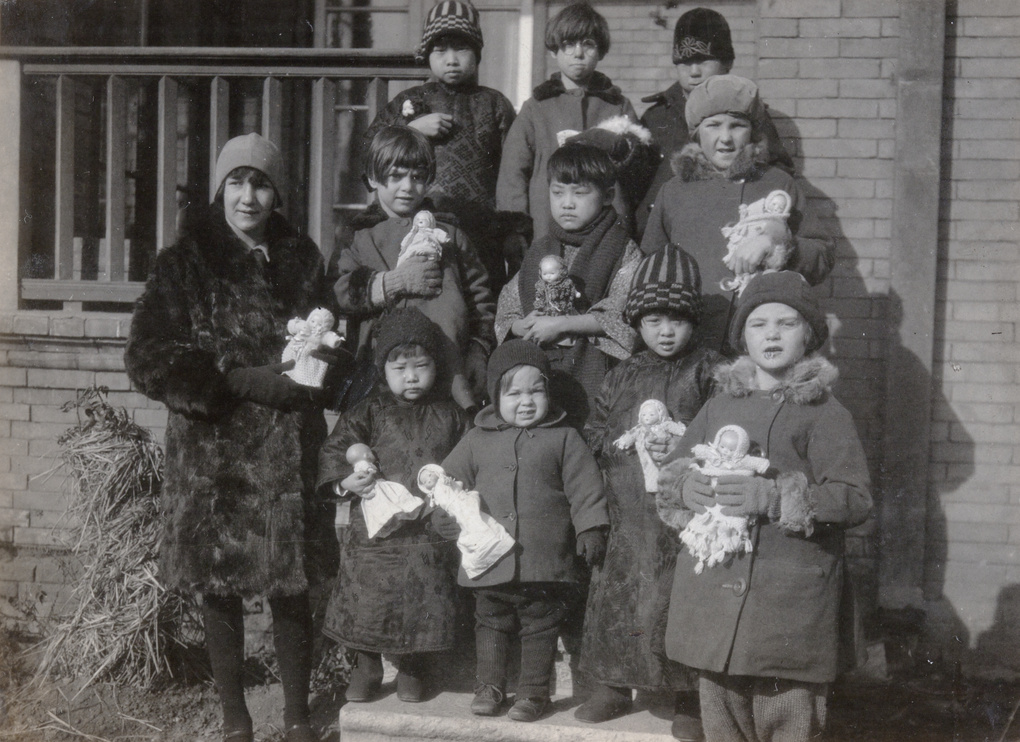 Children with dolls at the London Missionary Society compound, Tientsin