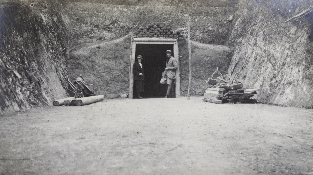 A couple smoking at the entrance of the no 2 tunnel, China Mining & Metal Company Ltd., Tien Sze Liang