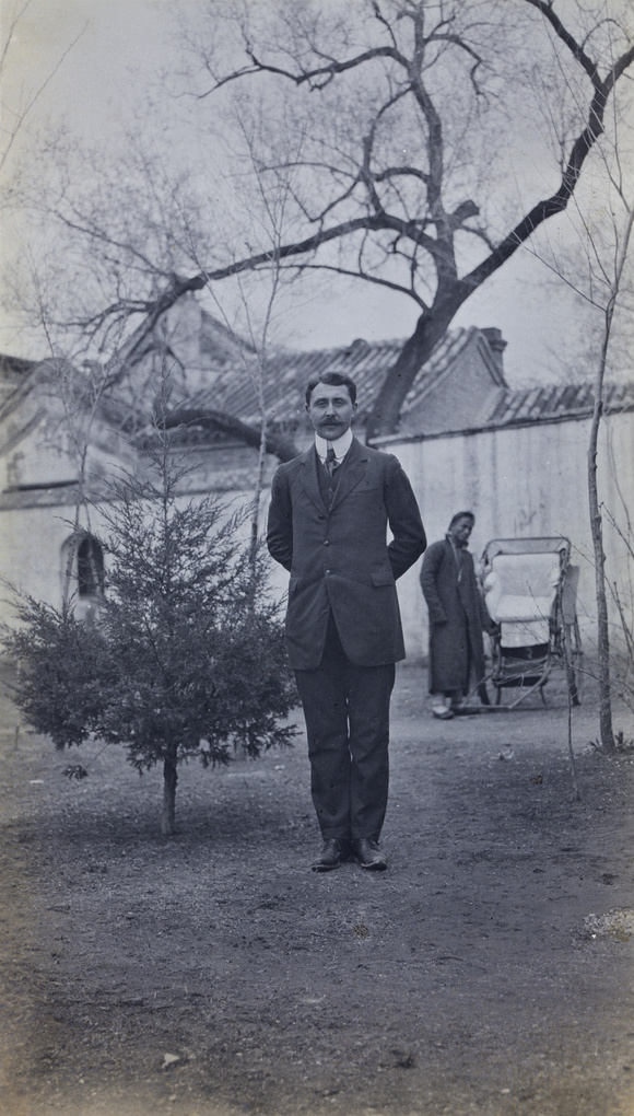 An unidentified man, with a tree