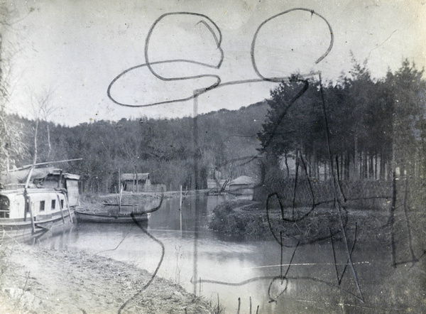 Houseboat 'Patrol' and rowing boat