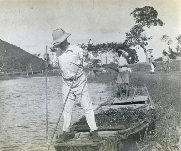 A foreigner with poles on a boat