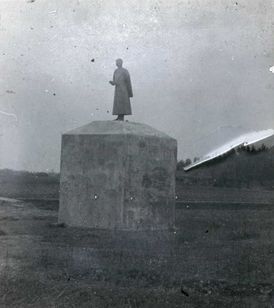 Statue with large pedestal