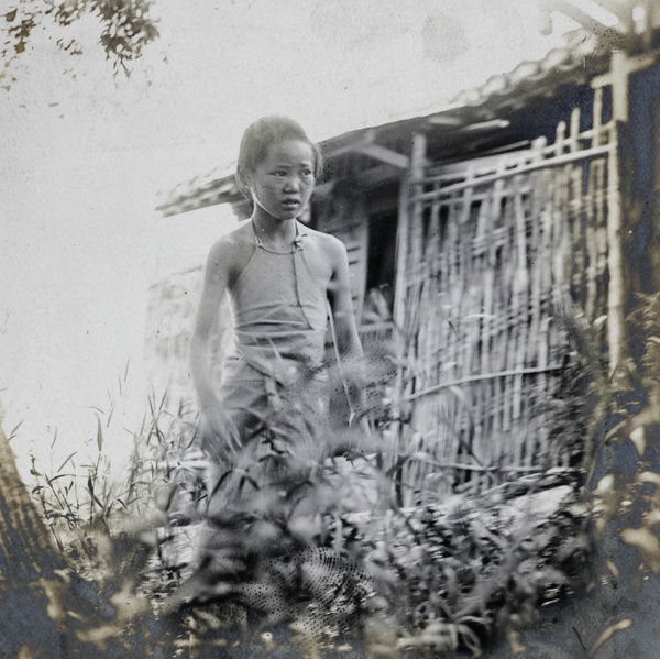 Girl outside a hut