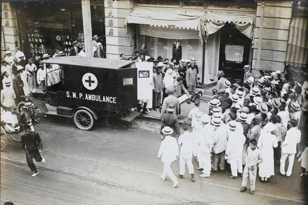 A Shanghai Municipal Police ambulance outside Deutsche Apotheke (Sine Pharmacy), 14 Broadway, Shanghai