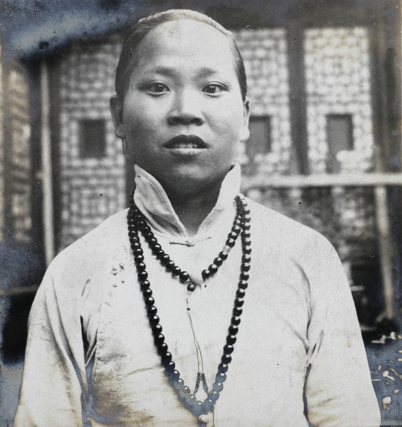 A young woman with a beaded necklace