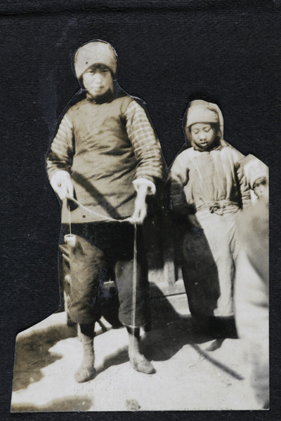 Three children, with a toy