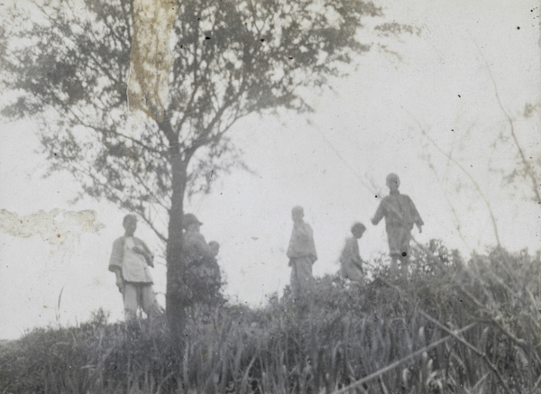 People on a river bank