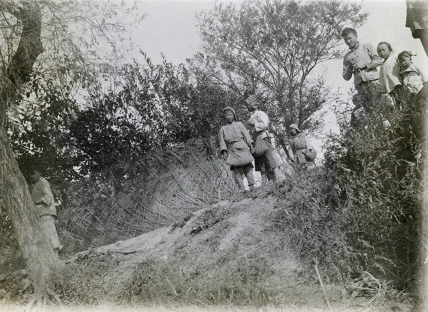 People on a river bank