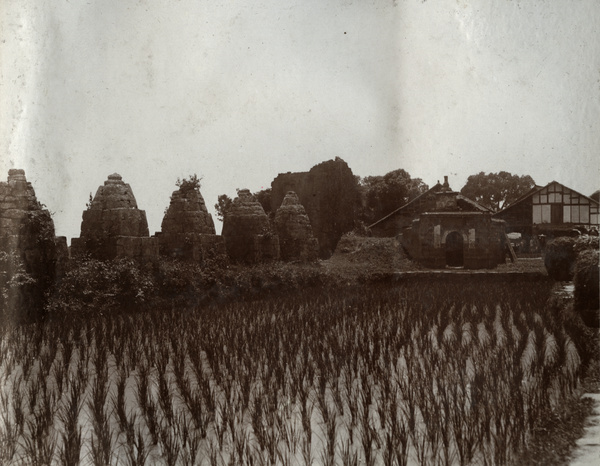 Paddy field and ancient landmarks on road to Kweilin