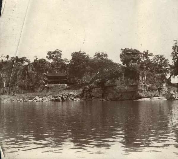 Clifftop temple beside a river