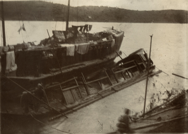 Drying laundry on a boat beside the wreck of the 'Archdeacon Byrde', Cassia River