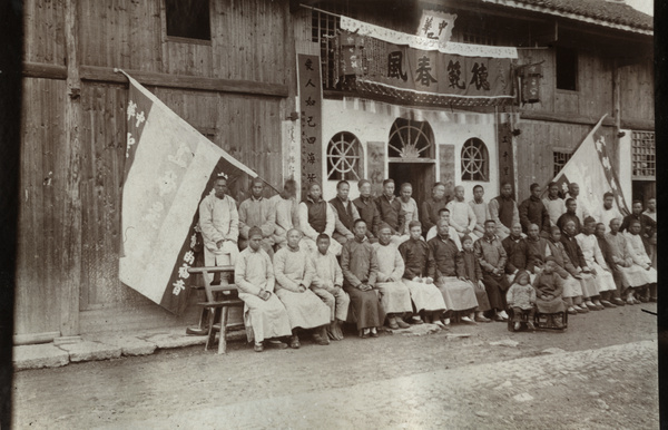 Large group outside a decorated building